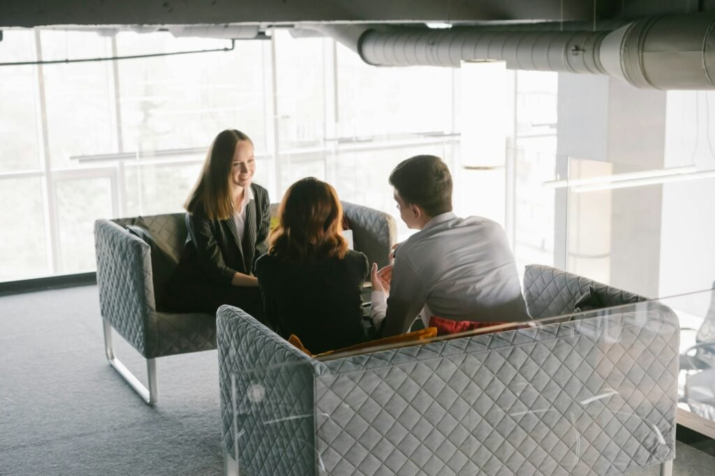 A young couple at an appointment with a psychologist or coach.